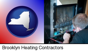 Brooklyn, New York - a heating contractor servicing a gas fireplace
