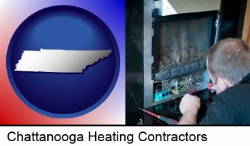 a heating contractor servicing a gas fireplace in Chattanooga, TN