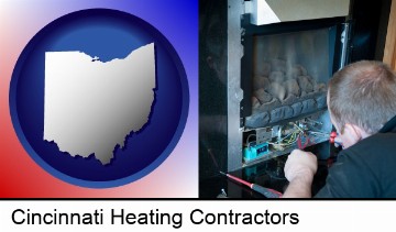 a heating contractor servicing a gas fireplace in Cincinnati, OH