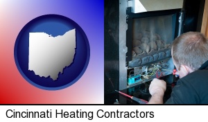 Cincinnati, Ohio - a heating contractor servicing a gas fireplace
