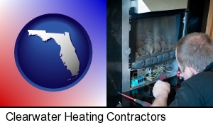 a heating contractor servicing a gas fireplace in Clearwater, FL