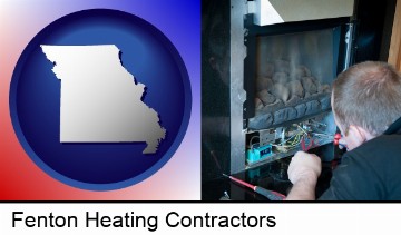 a heating contractor servicing a gas fireplace in Fenton, MO