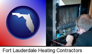 a heating contractor servicing a gas fireplace in Fort Lauderdale, FL