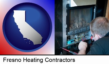 a heating contractor servicing a gas fireplace in Fresno, CA