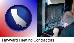 a heating contractor servicing a gas fireplace in Hayward, CA