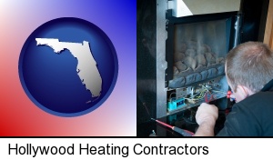 a heating contractor servicing a gas fireplace in Hollywood, FL