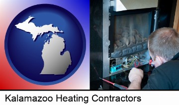 a heating contractor servicing a gas fireplace in Kalamazoo, MI