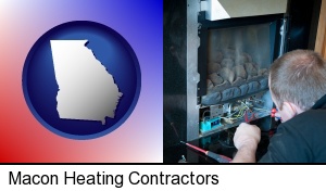a heating contractor servicing a gas fireplace in Macon, GA