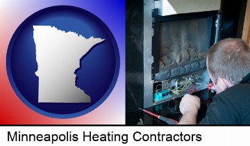 a heating contractor servicing a gas fireplace in Minneapolis, MN