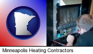 Minneapolis, Minnesota - a heating contractor servicing a gas fireplace