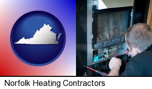 a heating contractor servicing a gas fireplace in Norfolk, VA