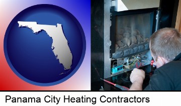 a heating contractor servicing a gas fireplace in Panama City, FL