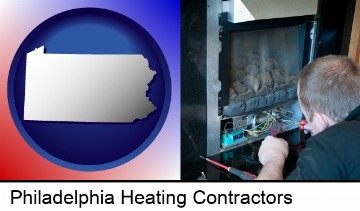 a heating contractor servicing a gas fireplace in Philadelphia, PA