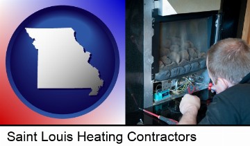 a heating contractor servicing a gas fireplace in Saint Louis, MO