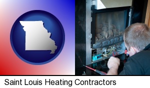 Saint Louis, Missouri - a heating contractor servicing a gas fireplace