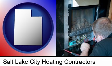 a heating contractor servicing a gas fireplace in Salt Lake City, UT