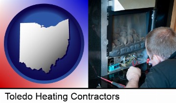 a heating contractor servicing a gas fireplace in Toledo, OH