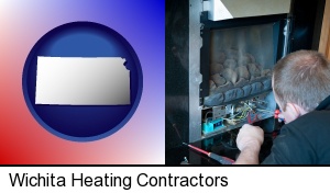 Wichita, Kansas - a heating contractor servicing a gas fireplace