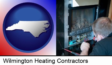 a heating contractor servicing a gas fireplace in Wilmington, NC