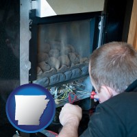 arkansas a heating contractor servicing a gas fireplace