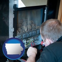 iowa a heating contractor servicing a gas fireplace