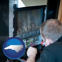 a heating contractor servicing a gas fireplace - with NC icon