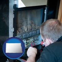 north-dakota map icon and a heating contractor servicing a gas fireplace