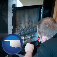 oklahoma a heating contractor servicing a gas fireplace