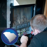 south-carolina a heating contractor servicing a gas fireplace