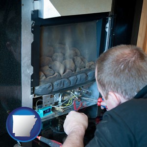 a heating contractor servicing a gas fireplace - with Arkansas icon