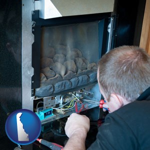 a heating contractor servicing a gas fireplace - with Delaware icon