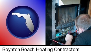 a heating contractor servicing a gas fireplace in Boynton Beach, FL