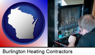 a heating contractor servicing a gas fireplace in Burlington, WI