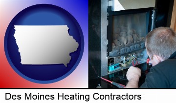 a heating contractor servicing a gas fireplace in Des Moines, IA