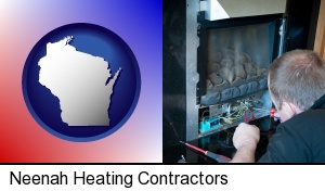 a heating contractor servicing a gas fireplace in Neenah, WI